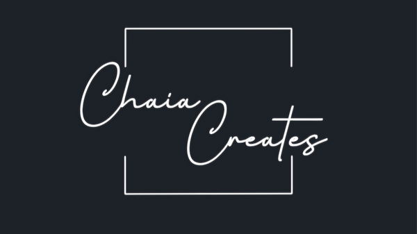 Chaia Creates Logo: The words "Chaia Creates" in white script font inside a white outline box. Minimalist style. Dark background.