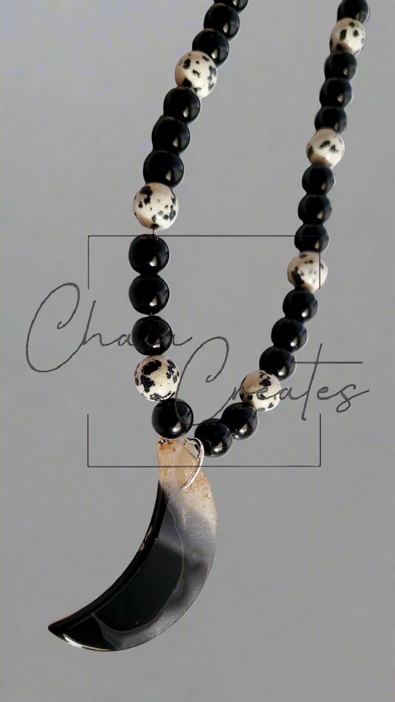 Black & Clear Druzy Agate Moon Pendant on Dalmatian Jasper and Onyx Beaded Necklace ©2024 Chaia Creates. All rights reserved. Unauthorized use or duplication of this content is prohibited.