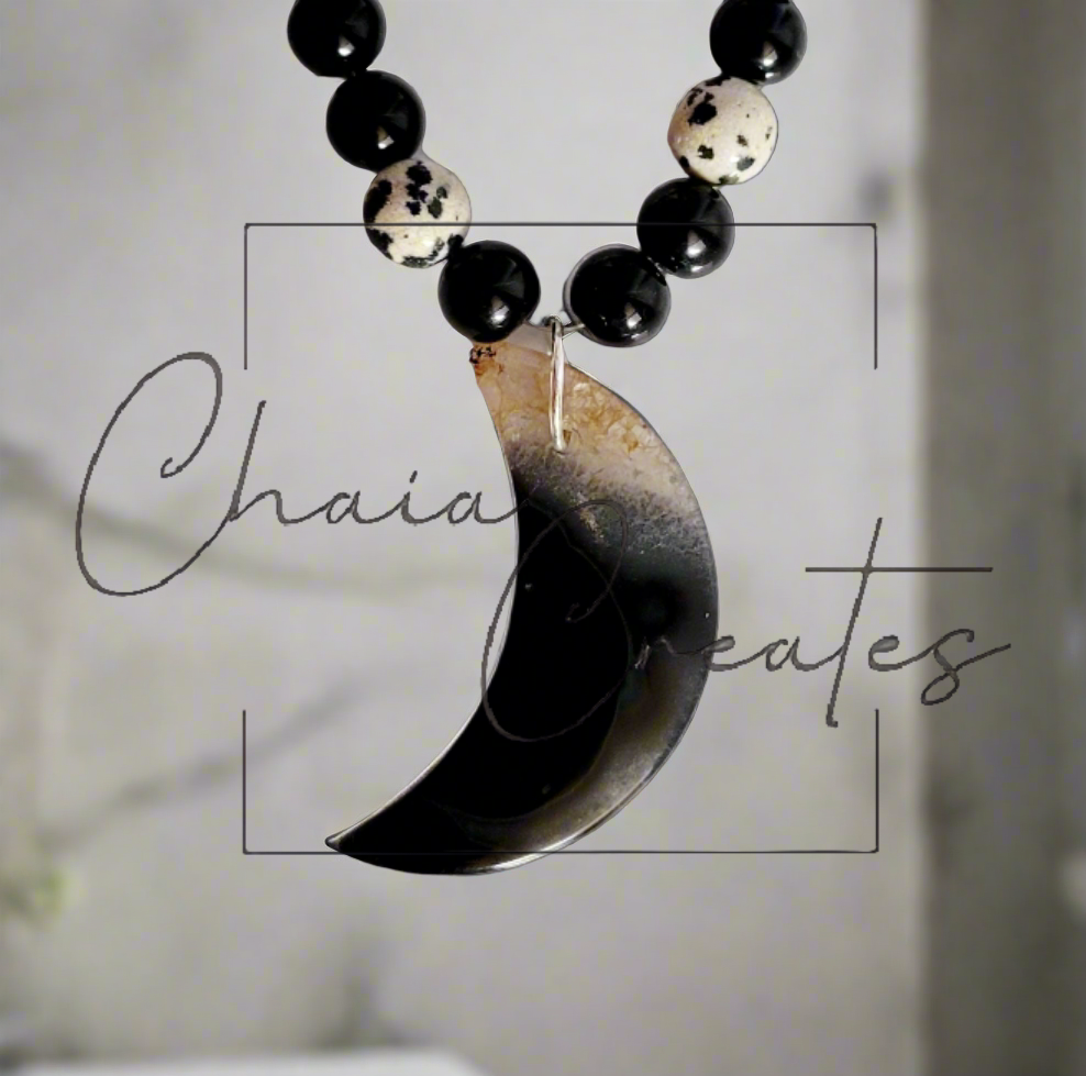 Black & Clear Druzy Agate Moon Pendant on Dalmatian Jasper and Onyx Beaded Necklace ©2024 Chaia Creates. All rights reserved. Unauthorized use or duplication of this content is prohibited.