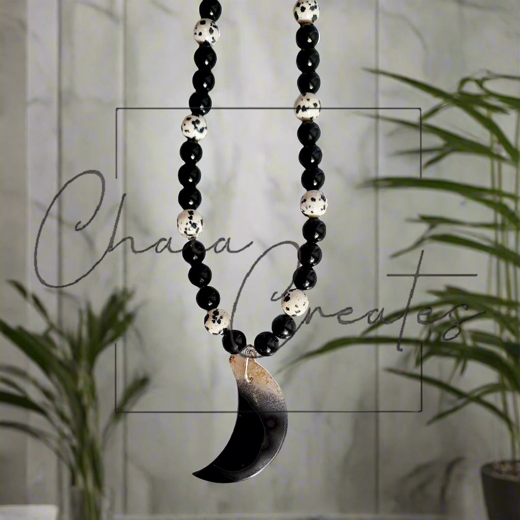 Black & Clear Druzy Agate Moon Pendant on Dalmatian Jasper and Onyx Beaded Necklace ©2024 Chaia Creates. All rights reserved. Unauthorized use or duplication of this content is prohibited.