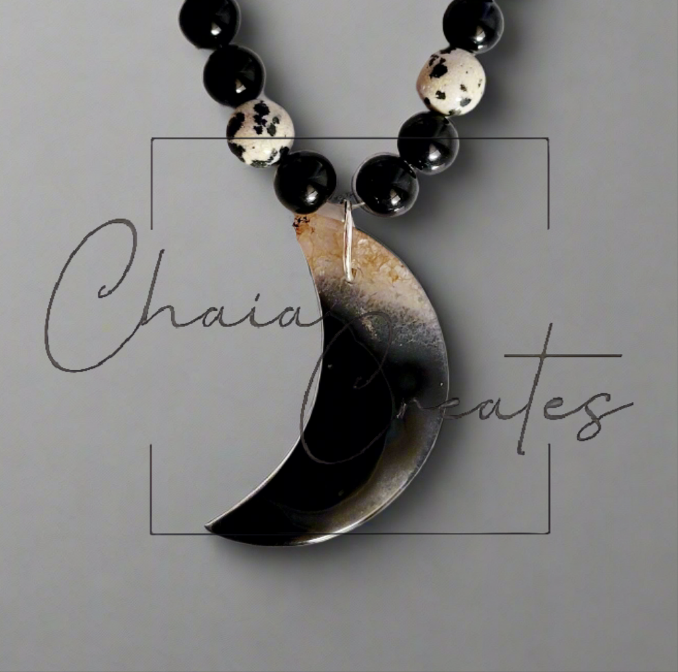 Black & Clear Druzy Agate Moon Pendant on Dalmatian Jasper and Onyx Beaded Necklace ©2024 Chaia Creates. All rights reserved. Unauthorized use or duplication of this content is prohibited.